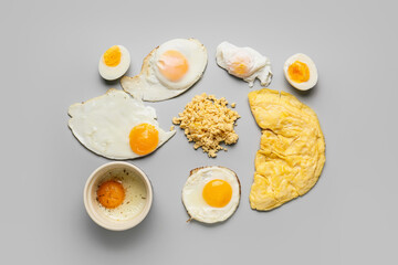 Set of different egg dishes on light background