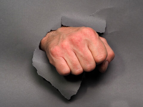 Fist Punching Through Paper