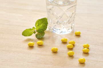 Yellow pills on a desk