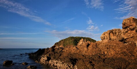 Fototapeta na wymiar sunset on the coast of island