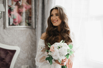 Luxury wedding bride, girl posing and smiling with bouquet