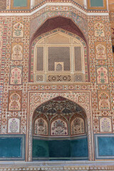 Intricate carvings and mosaics on the walls and ceilings, Sheesh Mahal, Jaipur, Rajasthan, India.
