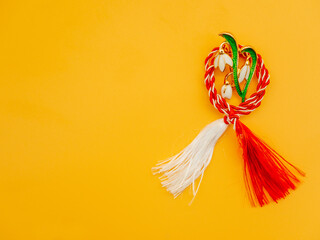 first of march balkan tradition red and white string martisor and decorative snowdrop brooch over...