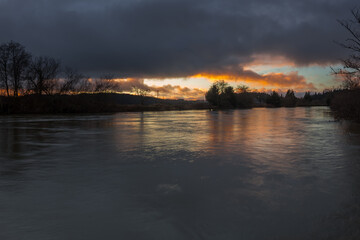 Cloudy bright sunset over Coquille river, Oregon