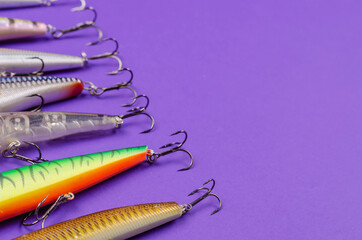 Artificial lures for fishing for predatory fish on a blue backgroun