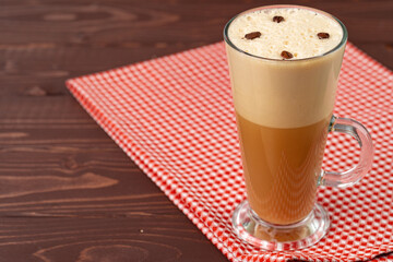 Cup of hot coffee latte on table