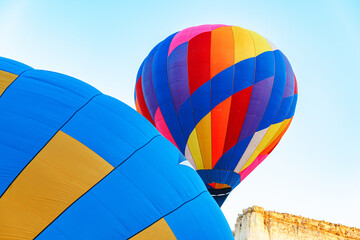 Obraz premium Close up of hot air balloon getting prepared for flight