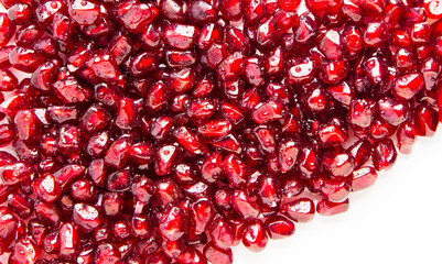 Background from large pomegranate berries. Berry background.