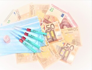 Syringes and masks on banknotes. Expensive treatment.