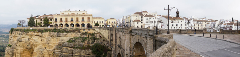 a panorama view of the old town of Ronda and the Puente Nuevo over El Tajo Gorge
