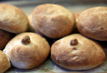 Warm and fresh homemade bread rolls. Food background