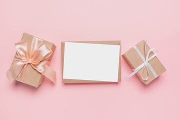 Gifts with note letter on isolated pink background, love and valentine concept