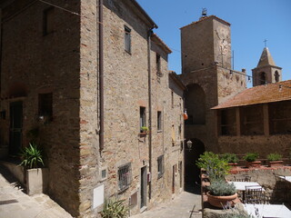 Internal side of Porta di Santa Maria del Giglio and of its bell tower that was the ancient gateway along the walls to the historic center of Castiglione della Pescaia.