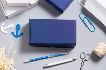 Blue cardboard box on office desk, Navy concept