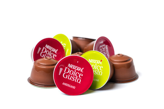 January 2021,Milan, Italy Set of Nescafe Dolce Gusto coffee capsules isolated on white background Top view Flat lay Drink obtained from dosed capsule with roasted, ground, compressed natural coffee