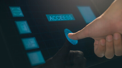 Close up human finger is touching interface computer monitor, fingerprint biometric identity and approval.  future security and password control 