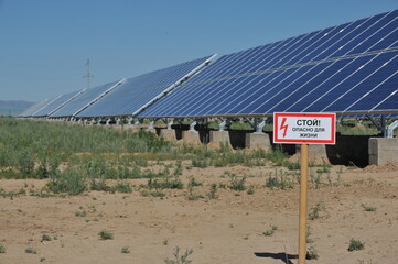 Zhambyl region, Kazakhstan - 05.15.2013 : Warning sign in Russian: Stop. Life-threatening. Solar...