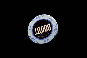 a Casino chip over black background