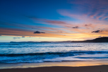 Naklejka na ściany i meble Sunset and clouds at the seaside