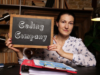 Conceptual photo about Ceding Company with written text on chalkboard.