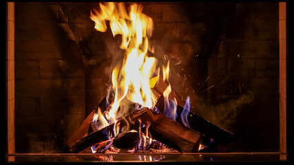 fireplace splash with burning trees at night