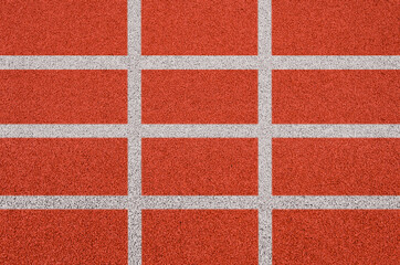 Top view of the running track rubber lanes cover texture with white line marking for background.