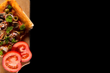 Served pizza with copy space. Slice of pizza with mushrooms on black background. Vegan pizza slice.