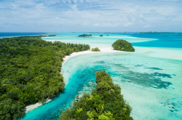 Aerial view of tropical islands in Palau, beaches, lagoon, reefs and palm trees.