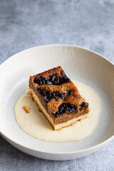 Prune and walnut cake with vanilla custard