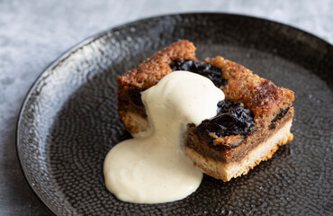 Prune and walnut cake with vanilla custard