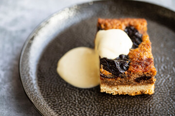 Prune and walnut cake with vanilla custard