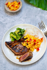 Seared tuna steak with pineapple salsa, rice and avocado