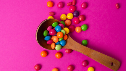 multicolored candy set with a wooden spoon