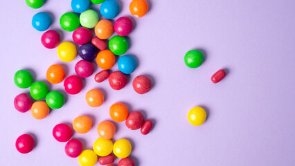 colorful little candies on a colored background