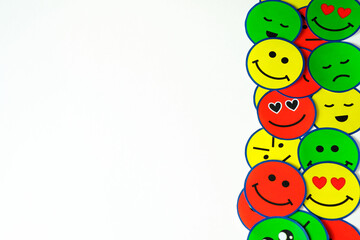 Emoticons with faces of emotions on one side and on a white background, to pdoer write a text or a title, ideal for emotional education, psychology.