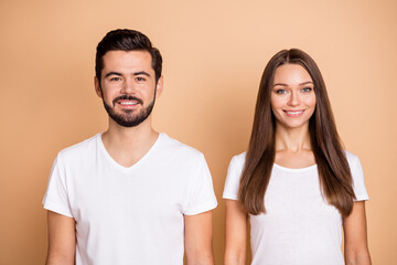 Fototapeta premium Photo of young attractive cheerful couple family happy positive smile isolated over beige color background