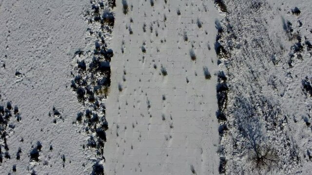 Drone footage of the former airbase RAF Martlesham Heath covered in snow in Suffolk, UK
