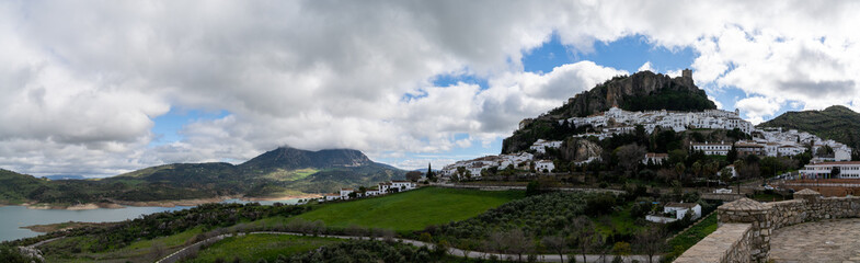 Fototapeta na wymiar panorama view of the whitwashed Andalusian village of Zahara de la Sierra and its Moorish Castle on the hilltop