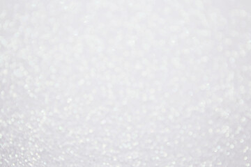 Glitter bokeh shiny background white