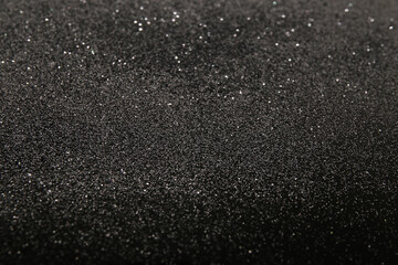 silver glitter on a black background