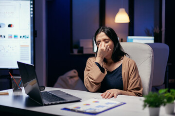 Portrait of freelancer having a headache feeling overworked because of job deadline. Employee...