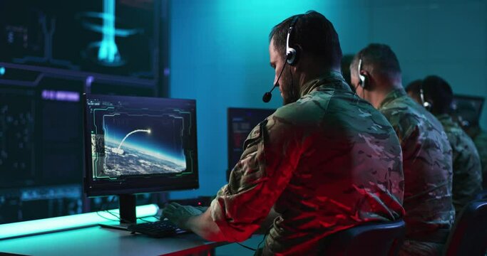 Soldiers controlling atomic explosions during war