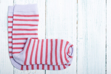 striped socks frame background on white wooden