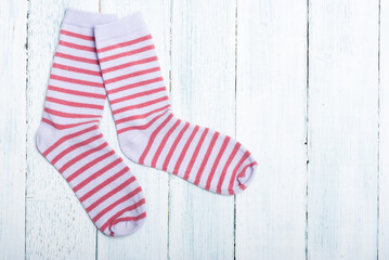 striped socks frame background on white wooden