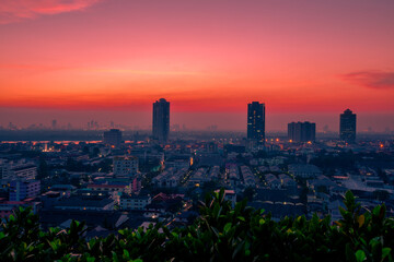 The high angle background of the city view with the secret light of the evening, blurring of night lights, showing the distribution of condominiums, dense homes in the capital community