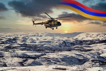 Armenian national flag and armenian military helicopter in winter with gorgeous sunset