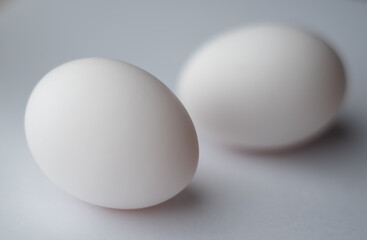 two eggs, one out of focus