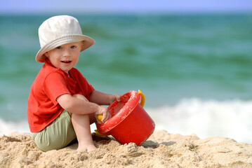 Little boy playing on the beach