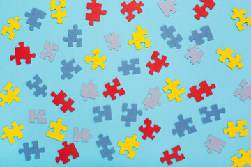 Creative design for April 2, Autism World Awareness day. Jigsaw colorful puzzle element, top view, flat lay.
