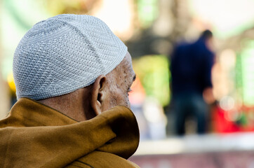OLD MAN WITH HAT FOR PRAYER